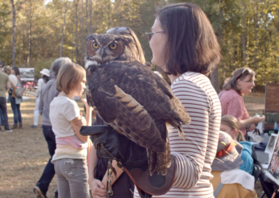 Lindsay holding owl at wildlife event