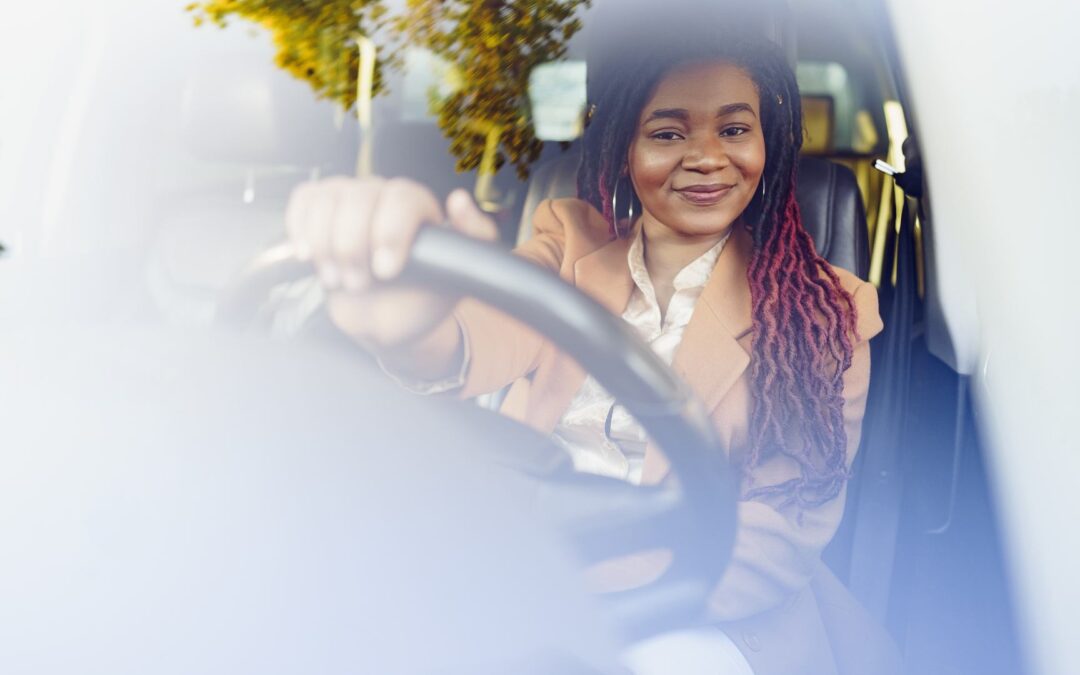 Woman in car driving to work