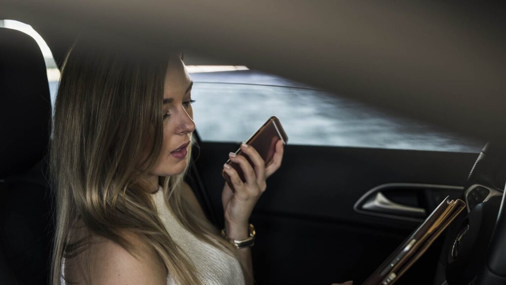 Girl driving while on her phone