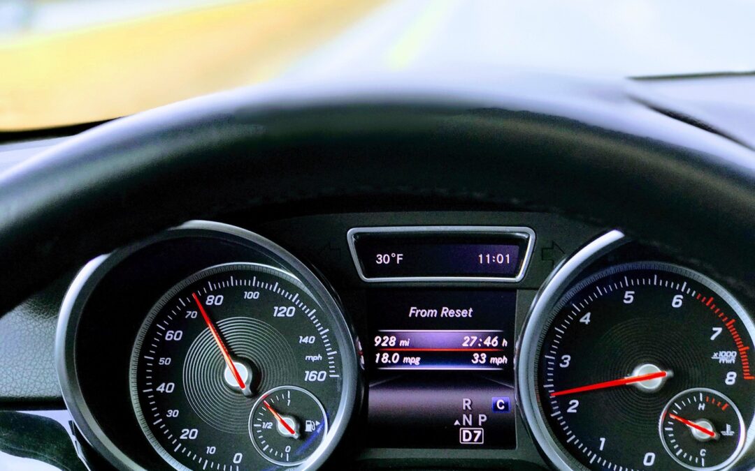 Car speeding interior gauge view