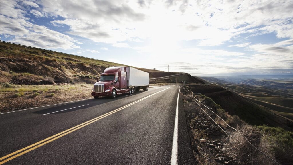 Trucker driving on country road