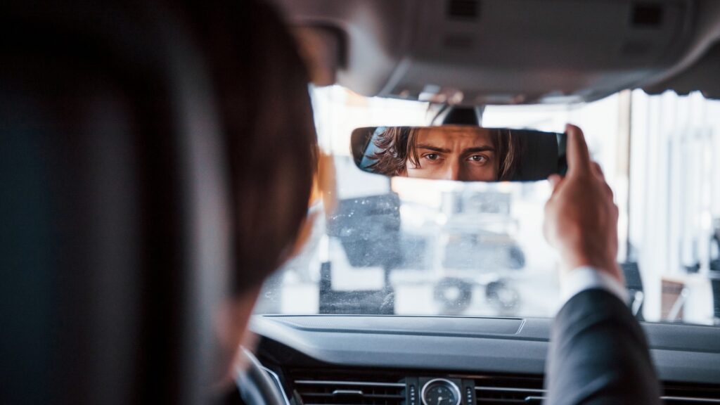 driver looking in rearview mirror