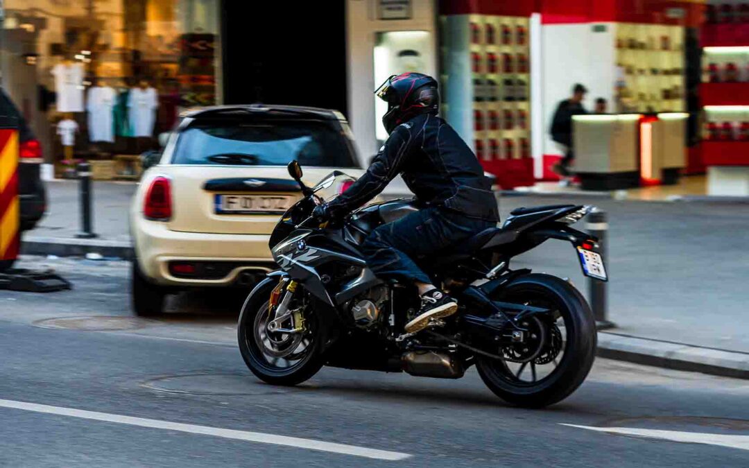 Motorcyclist riding through city traffic in Georgia, highlighting risks that often lead to motorcycle accidents and injury claims.